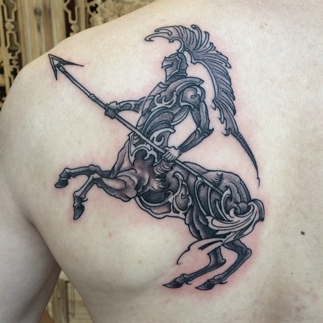 Black Ink Sagittarius Zodiac Sign Tattoo On Left Back Shoulder