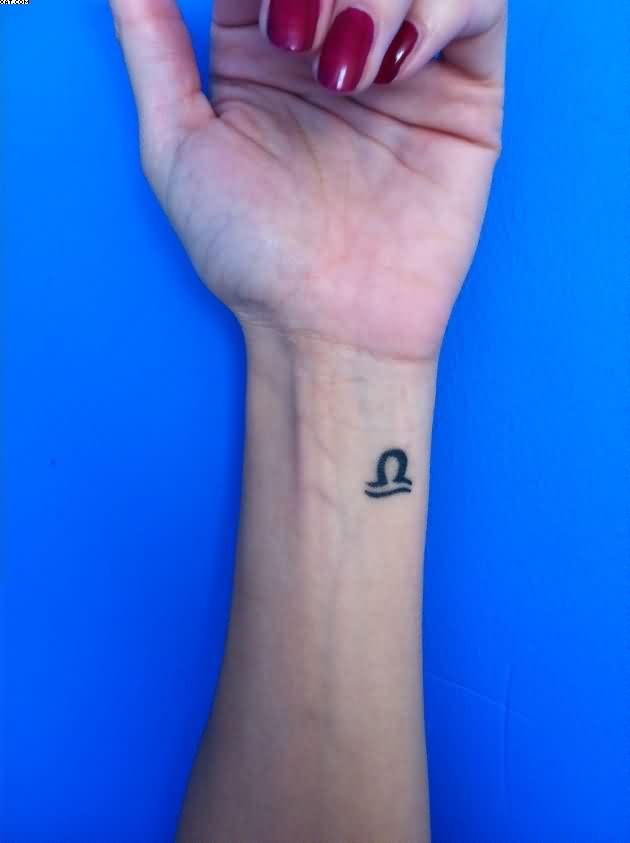 Black Ink Scorpio Zodiac Sign Tattoo On Girl Left Wrist
