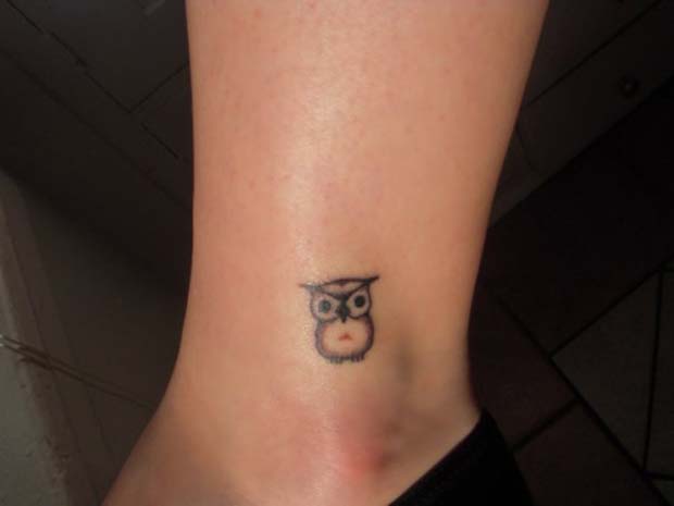 Black Ink Small Owl Tattoo On Ankle