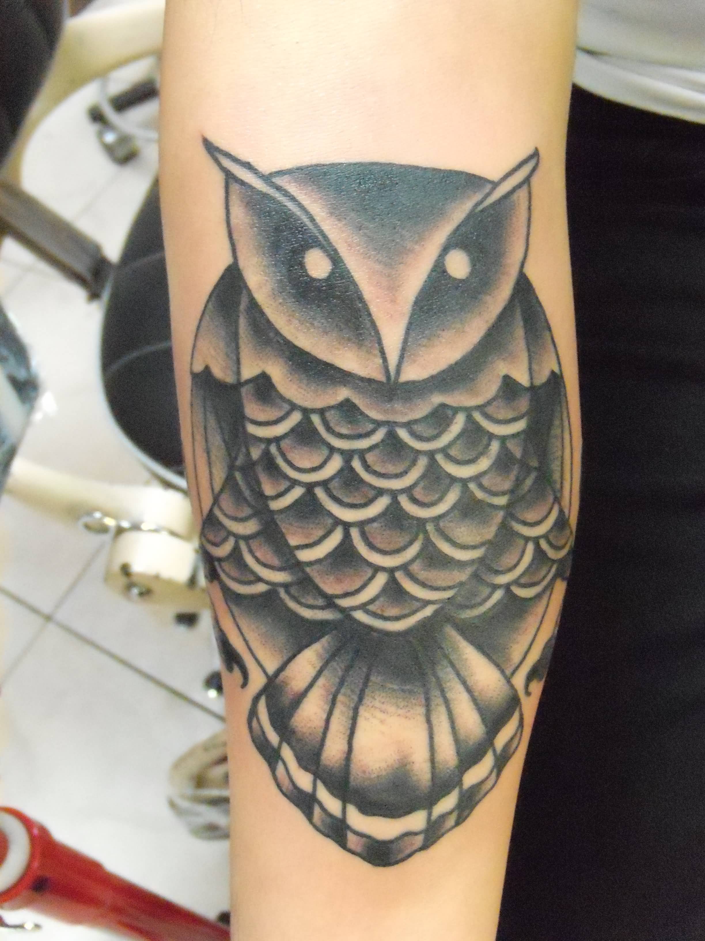 Black Ink Traditional Owl Tattoo On Forearm