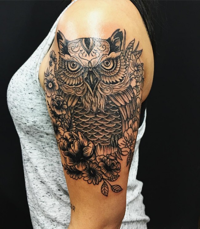 Black Ink Traditional Owl With Flowers Tattoo On Girl Left Half Sleeve