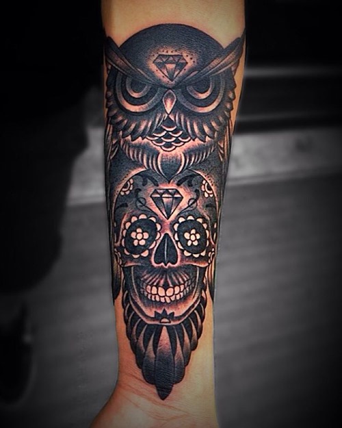 Black Ink Traditional Owl With Sugar Skull Tattoo On Forearm