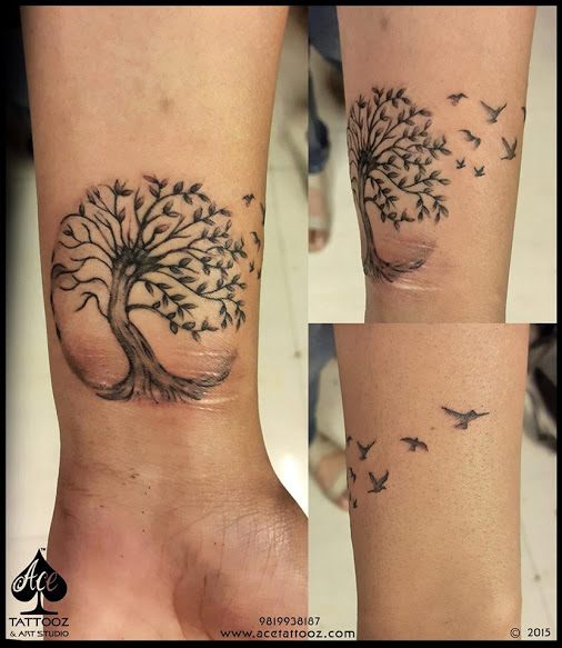 Black Ink Tree Of Life With Flying Birds Tattoo On Wrist By