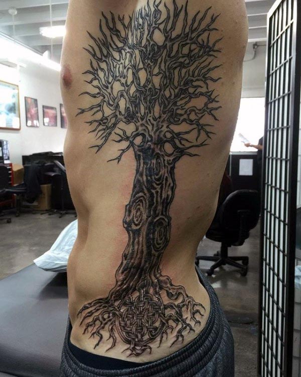 Black Ink tree Of Life Tattoo On Man Left Side Rib