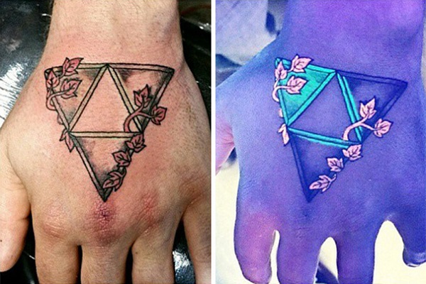 Black Light Triforce Triangle Tattoo On Left Hand