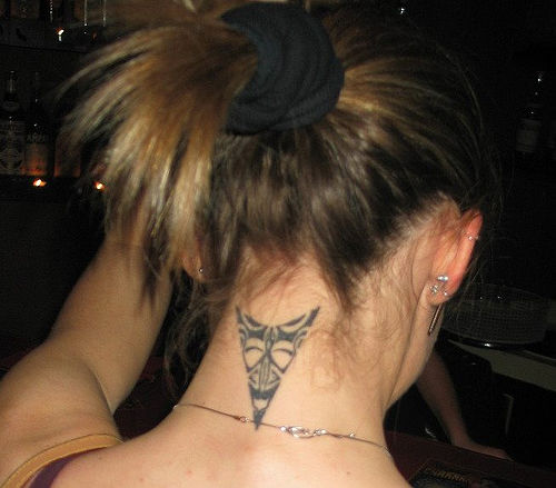 Black Maori Triangle Tattoo On Girl Back Neck