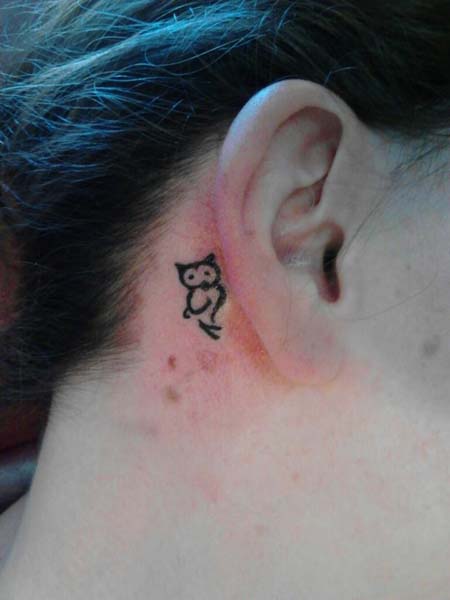 Black Outline Small Owl Tattoo On Right Behind The Ear