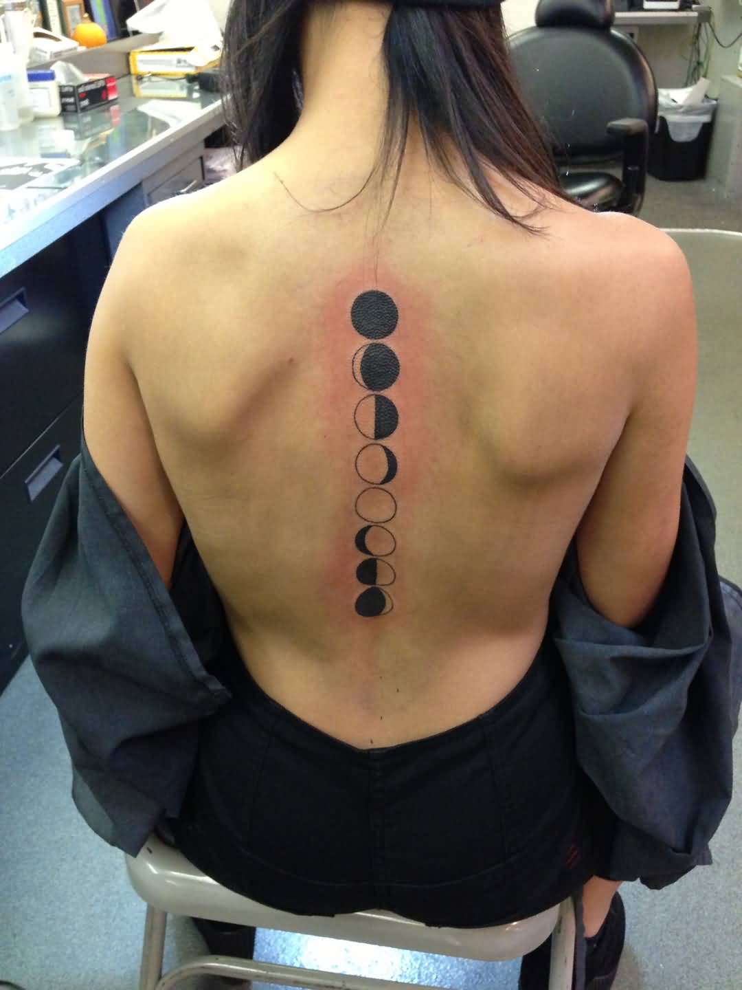 Black Phases Of The Moon Tattoo On Girl Full Back.