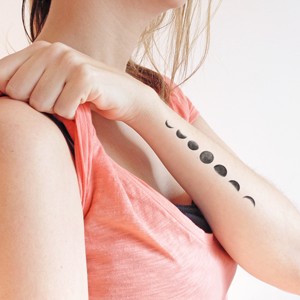 Black Phases Of The Moon Tattoo On Girl Left Arm