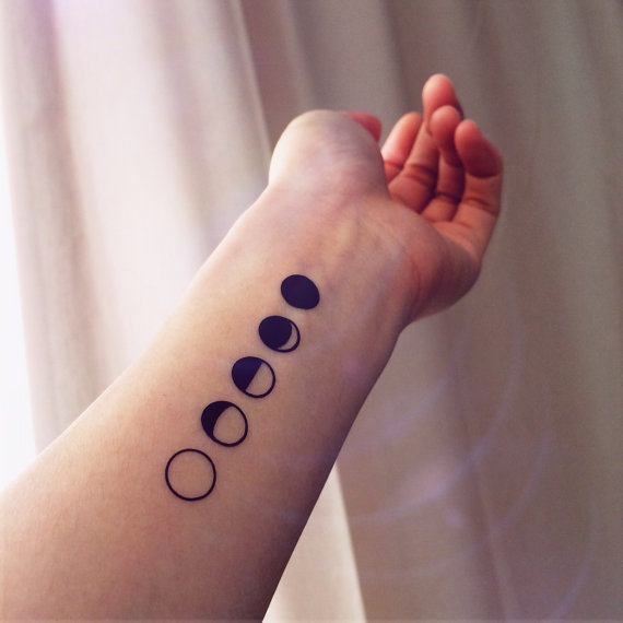 Black Phases Of The Moon Tattoo On Left Wrist