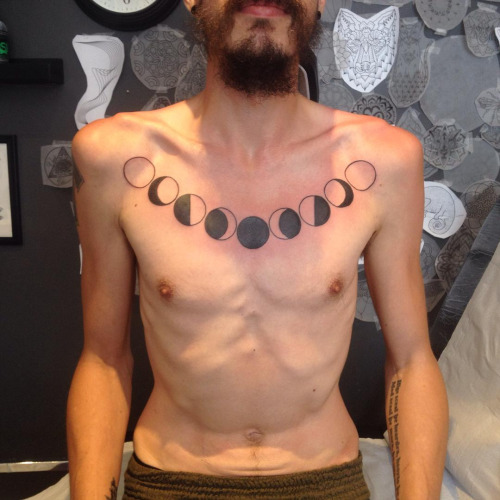 Black Phases Of The Moon Tattoo On Man Chest