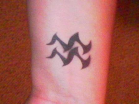 Black Tribal Aquarius Zodiac Sign Tattoo Design For Wrist
