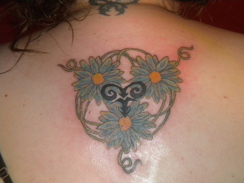 Black Tribal Aries Zodiac Sign With Flowers Tattoo Design For Upper Back