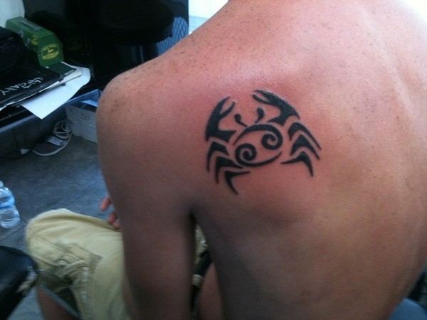 Black Tribal Cancer Zodiac Sign Tattoo On Man Left Back Shoulder