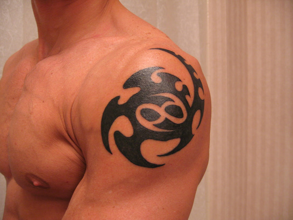 Black Tribal Cancer Zodiac Sign Tattoo On Man Left Shoulder