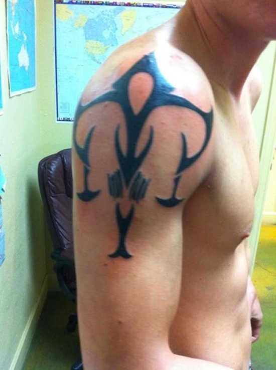 Black Tribal Libra Zodiac Sign Tattoo On Man Right Shoulder