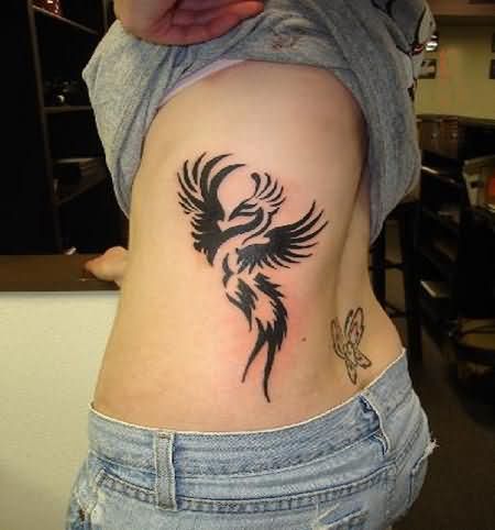 Black Tribal Phoenix Tattoo On Girl Left Side Rib