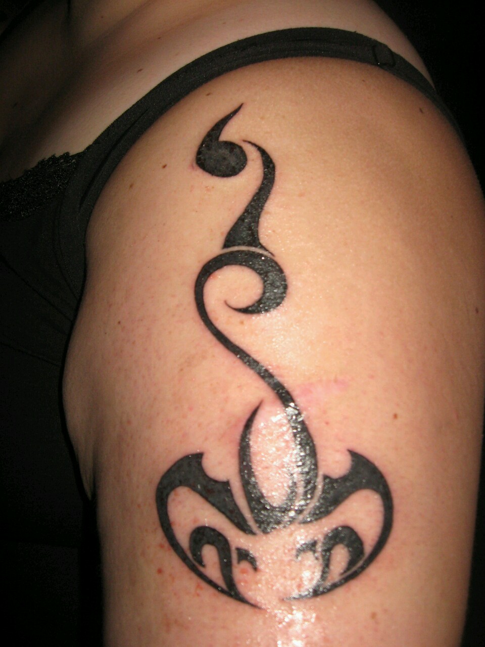 Black Tribal Scorpio Zodiac Sign Tattoo On Left Shoulder