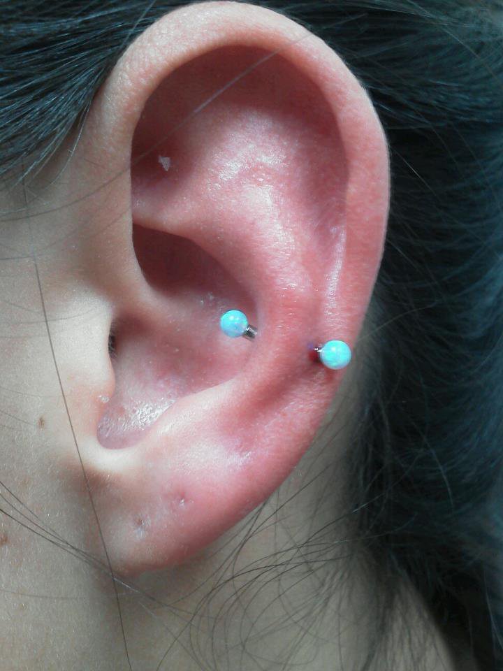 Blue Barbell Snug Piercing On Girl Left Ear