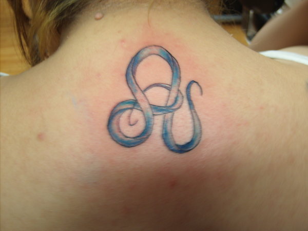 Blue Ink Leo Zodiac Sign Tattoo On Upper Back