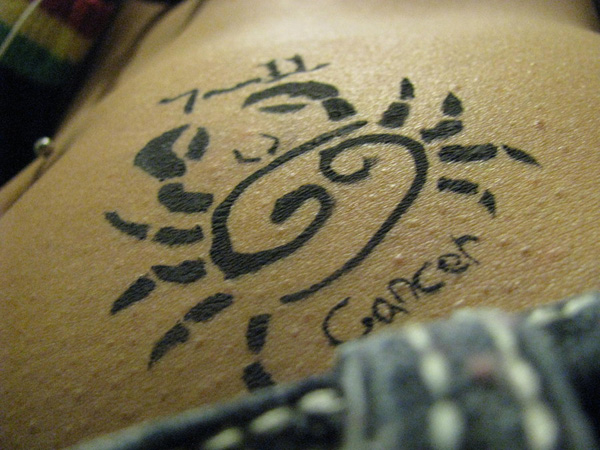 Cancer Zodiac Sign With Flower Tattoo Design For Stomach