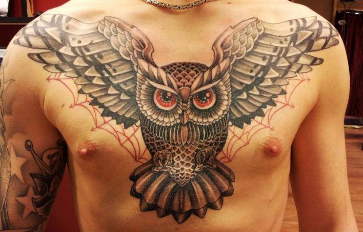 Classic Black Ink Flying Owl Bird Tattoo On Man Chest