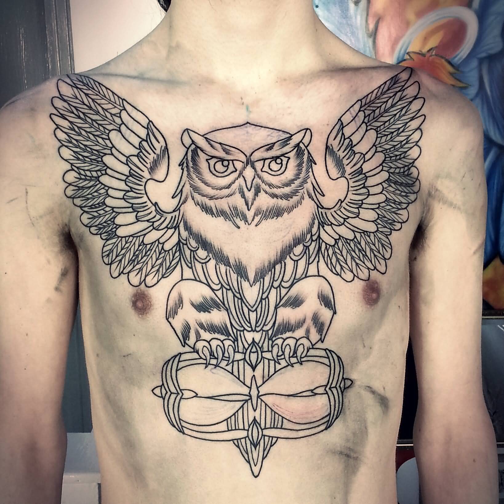 Classic Black Ink Flying Owl With Hourglass Tattoo On Man Chest