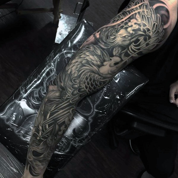 Classic Black Ink Phoenix Tattoo On Man Right Full Sleeve