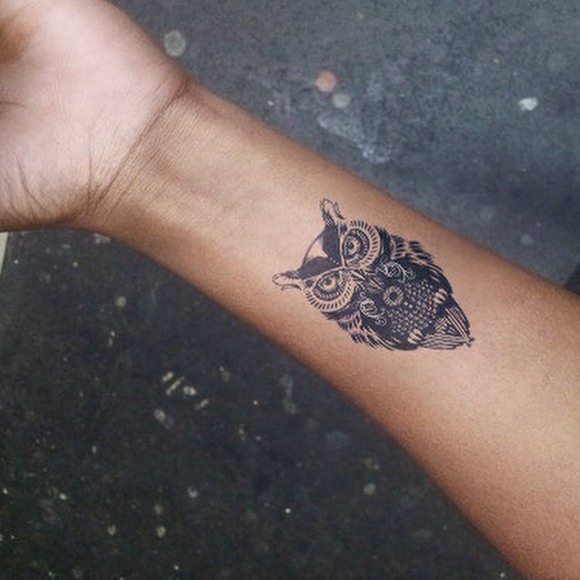 Classic Black Ink Small Owl Tattoo On Right Forearm