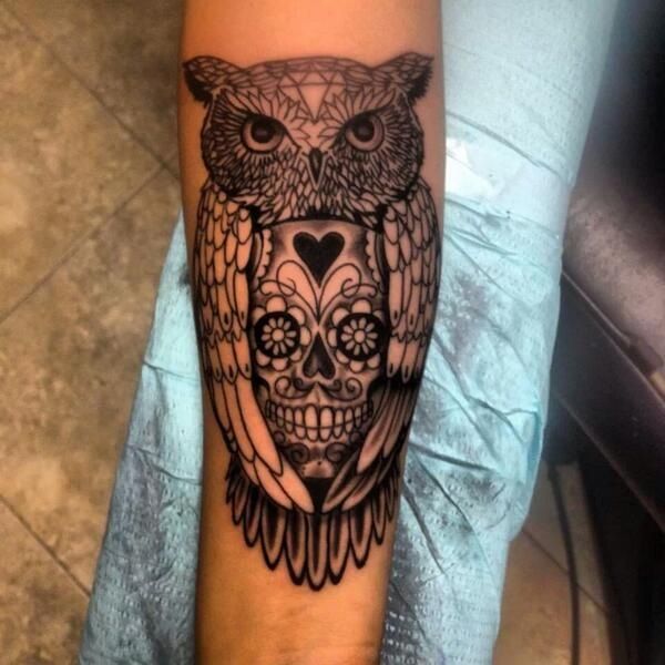 Classic Black Ink Traditional Owl With Sugar Skull Tattoo On Forearm