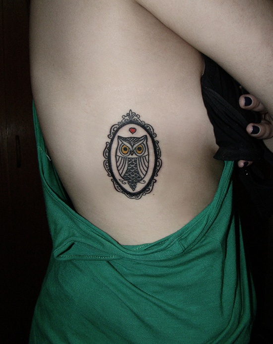 Classic Black Owl In Frame Tattoo On Girl Right Side Rib