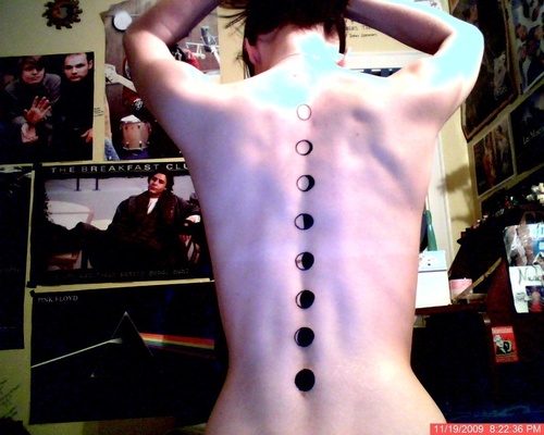 Classic Black Phases Of The Moon Tattoo On Spine.