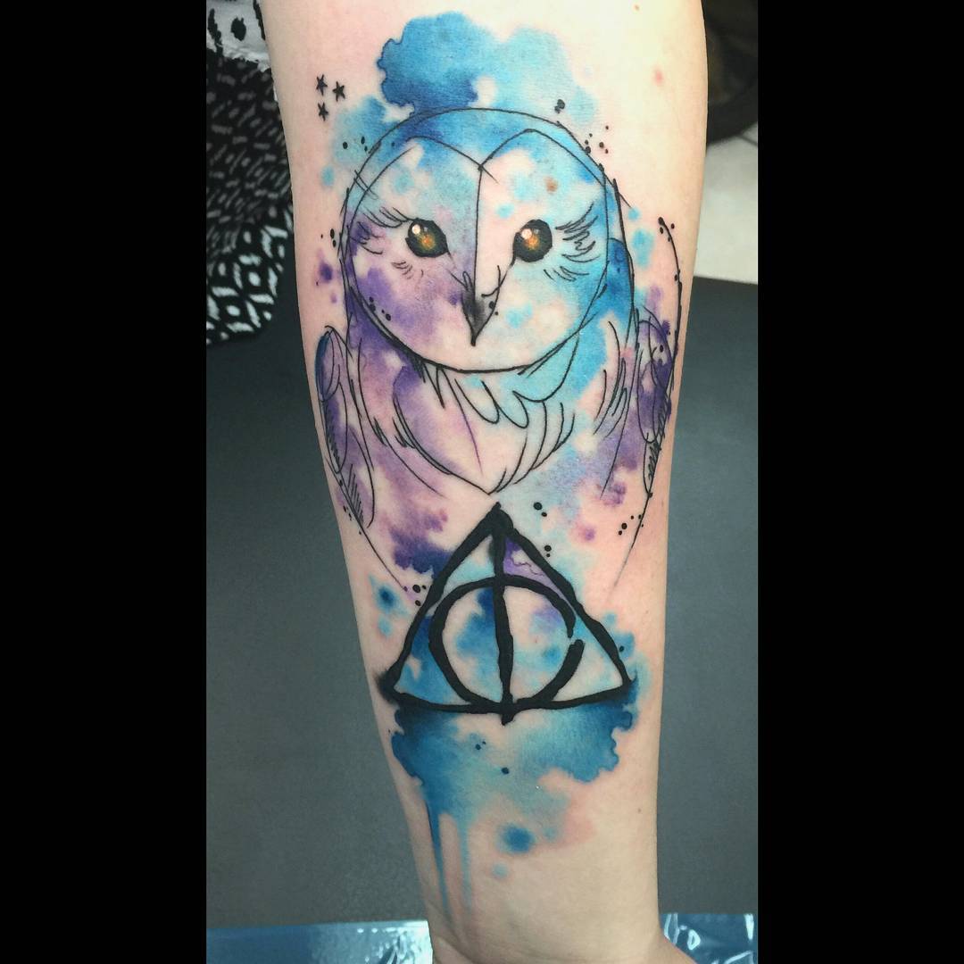 Classic Watercolor Owl With Deathly Hallows Symbol Tattoo On Forearm By Michael Ruffo