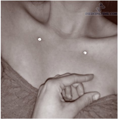 Clavicle Piercing With White Dermals