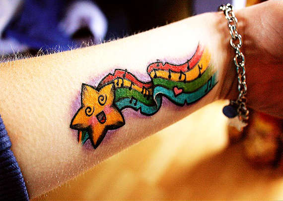 Colored Animated Star Tattoo On Left Forearm