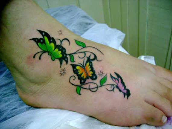 Colored Butterflies Foot Tattoo For Girls