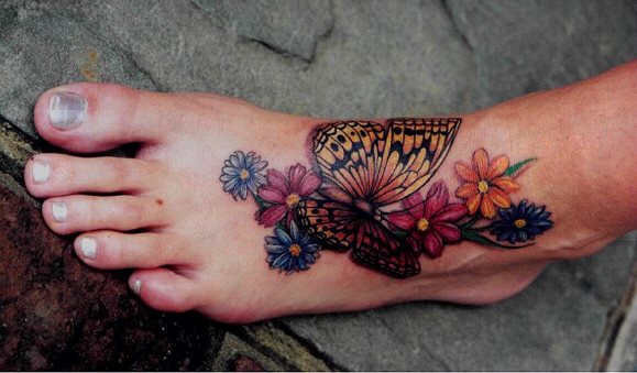 Colorful Flowers And Left Foot Butterfly Tattoo
