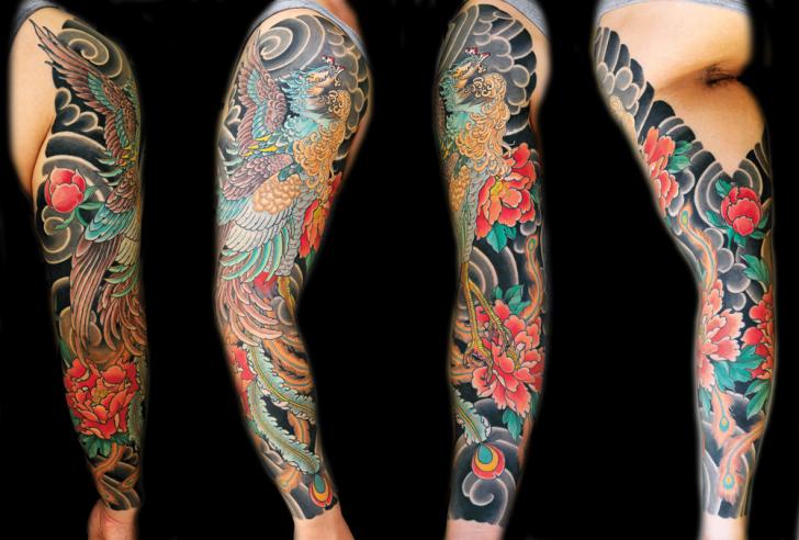 Colorful Flying Japanese Phoenix With Flowers Tattoo On Full Sleeve