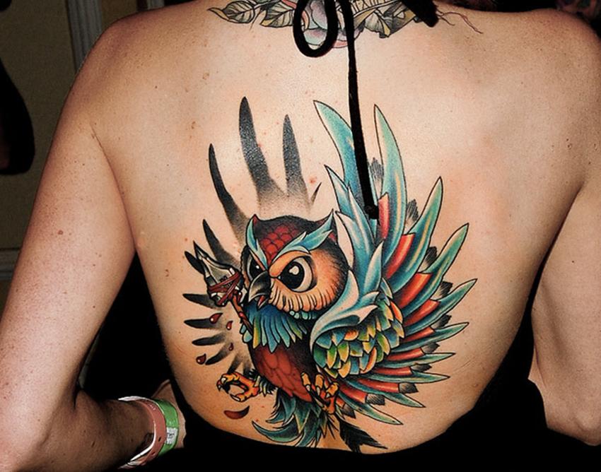 Colorful Flying Owl Tattoo On Girl Upper Back