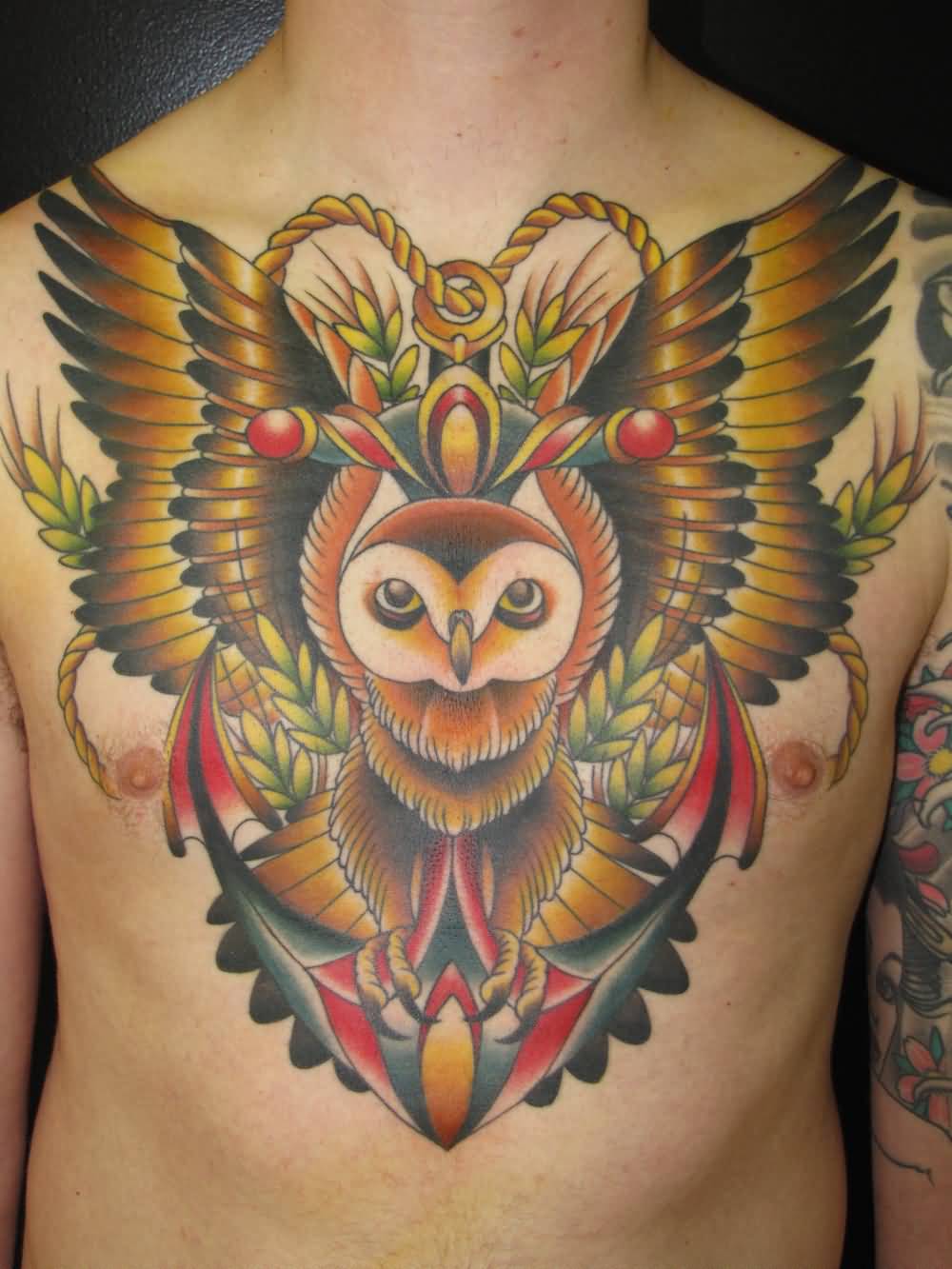 Colorful Flying Owl With Anchor Tattoo On Man Chest