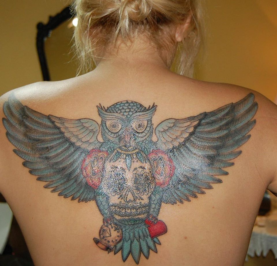Colorful Flying Owl With Sugar Skull Tattoo On Girl Upper Back