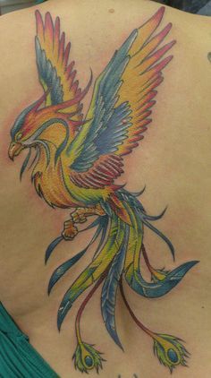 Colorful Flying Phoenix Bird Tattoo Design For Upper Back