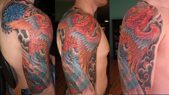 Colorful Flying Phoenix Tattoo On Man Right Half Sleeve By Kim Saigh
