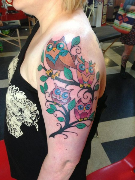 Colorful Owl Family On Branch Tattoo On Girl Left Half Sleeve