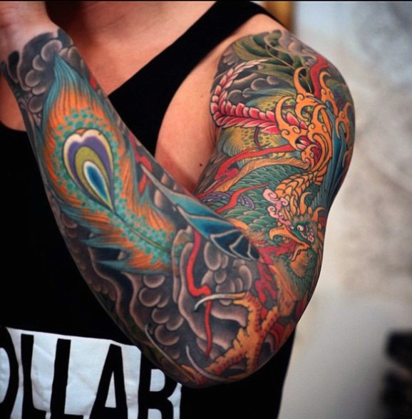 Colorful Phoenix Tattoo On Man Left Full Sleeve