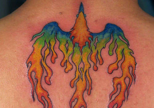 Colorful Rising Phoenix From The Ashes Tattoo Design For Upper Back