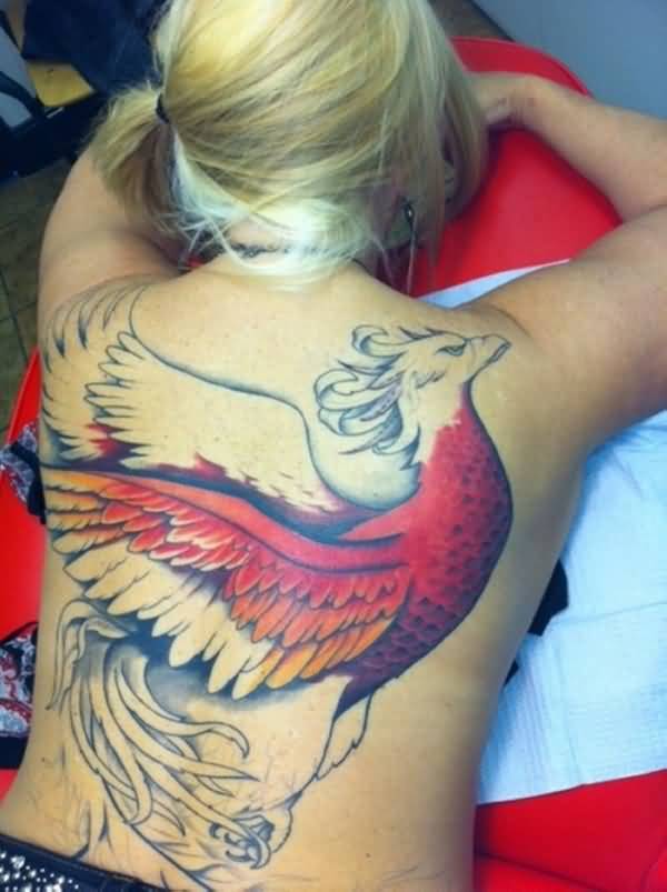 Colorful Rising Phoenix From The Ashes Tattoo On Girl Full Back