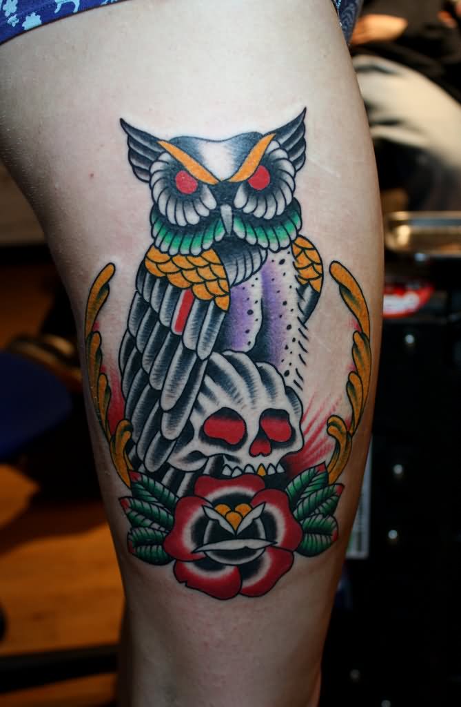 Colorful Traditional Owl With Skull And Flower Tattoo On Back Thigh By Myke Chambers