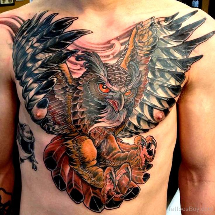 Colorful Traditional Flying Owl Bird Tattoo On Man Chest