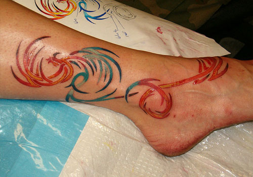 Colorful Tribal Phoenix Tattoo On Right Leg